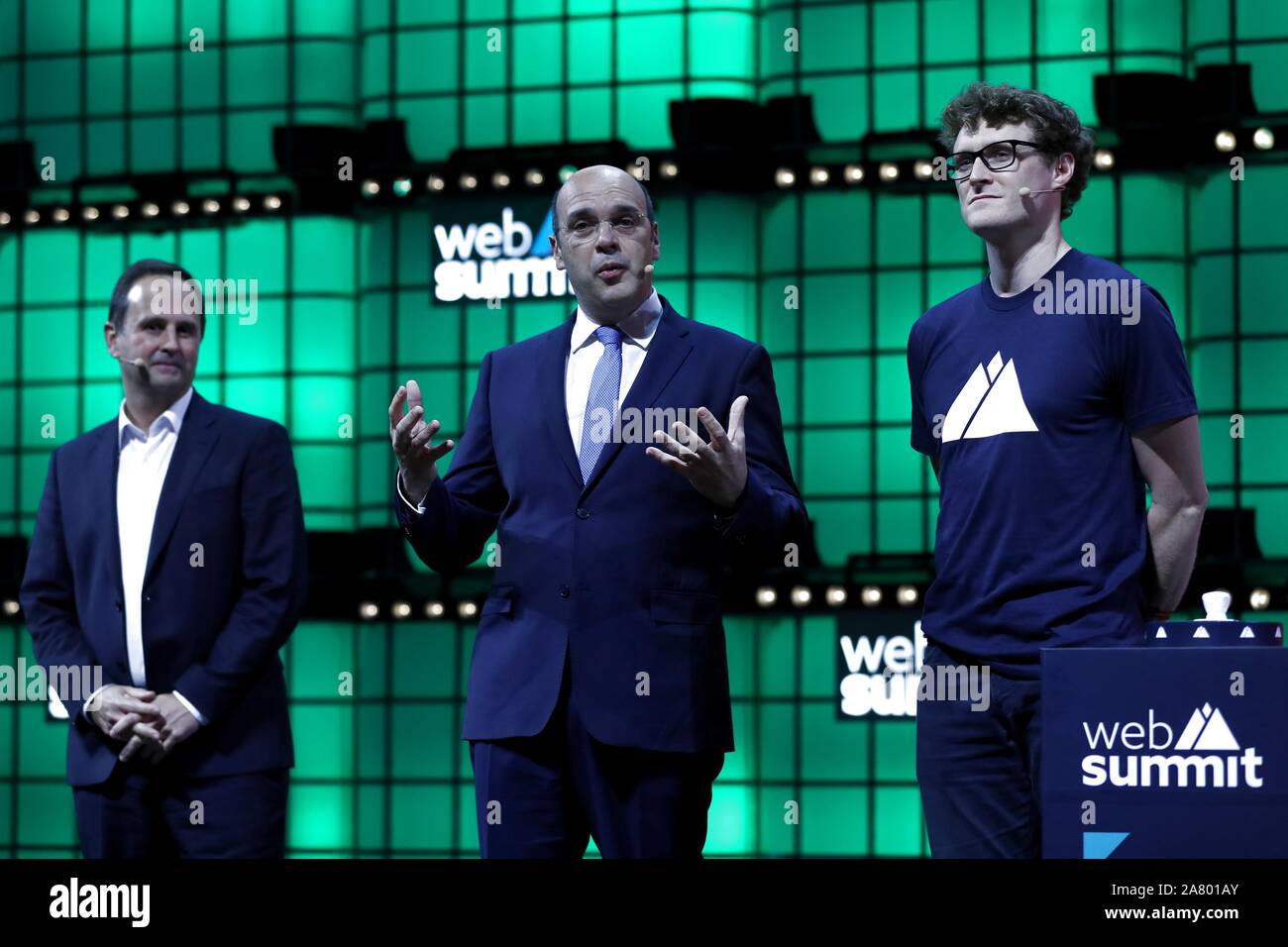 (191105) -- LISBON, Nov. 5, 2019 (Xinhua) -- Portuguese minister of economy and digital transition Pedro Siza Vieira (C) delivers a speech as Mayor of Lisbon Fernando Medina (1st L) and CEO of Web Summit Paddy Cosgrave (1st R) look on during the opening ceremony of the Web Summit in Lisbon, Portugal, Nov. 4, 2019. The Web Summit 2019 will be held in Lisbon from Nov. 4 to 7, hitting a record high with over 70,000 participants from 163 countries and regions. Over 1,200 speakers will attend the Web Summit in Portugal and speak on the 22 stages throughout the event. Founded in 2009 in Ireland, Stock Photo