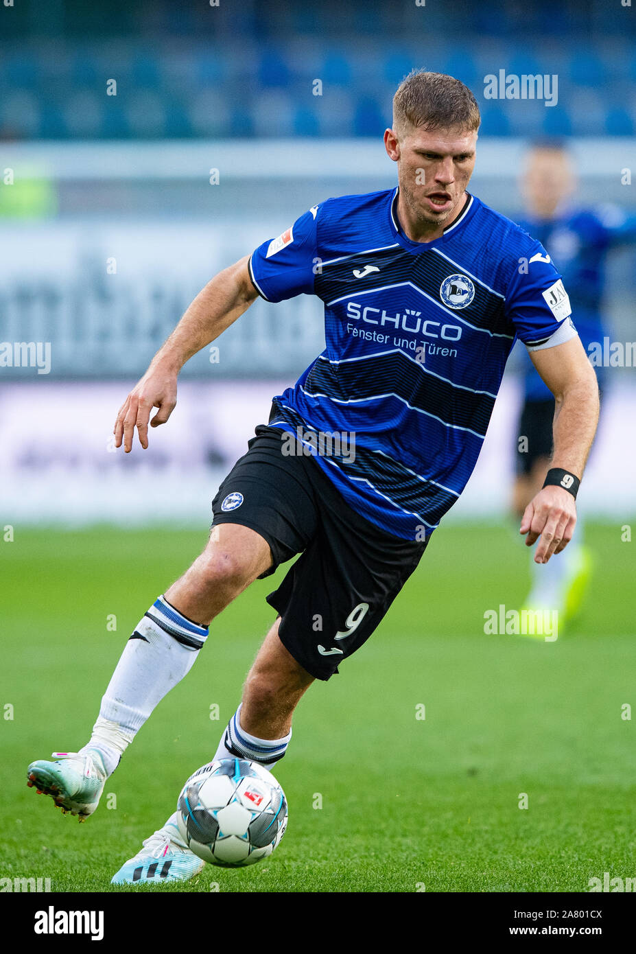 Bielefeld, Germany. 03rd Nov, 2019. Soccer: 2nd Bundesliga, Arminia Bielefeld - Holstein Kiel, 12th matchday in the Schüco Arena. Bielefeld's Fabian Klos on the ball. Credit: Guido Kirchner/dpa - IMPORTANT NOTE: In accordance with the requirements of the DFL Deutsche Fußball Liga or the DFB Deutscher Fußball-Bund, it is prohibited to use or have used photographs taken in the stadium and/or the match in the form of sequence images and/or video-like photo sequences./dpa/Alamy Live News Stock Photo