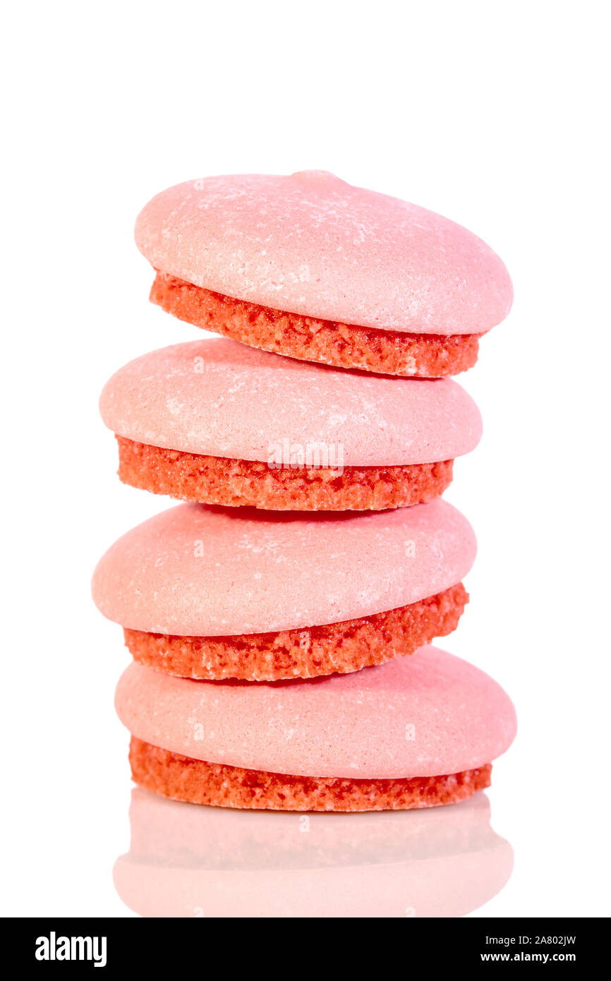 Round sweet biscuits or macarons isolated on white background, red colored Stock Photo