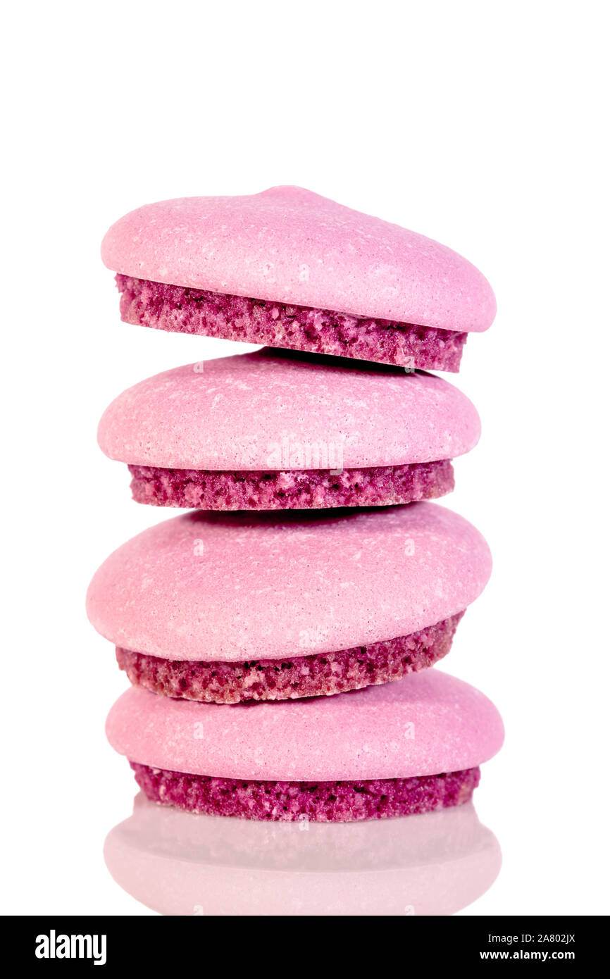 stack of sweet macarons or biscuits isolated on white background, purple colored Stock Photo