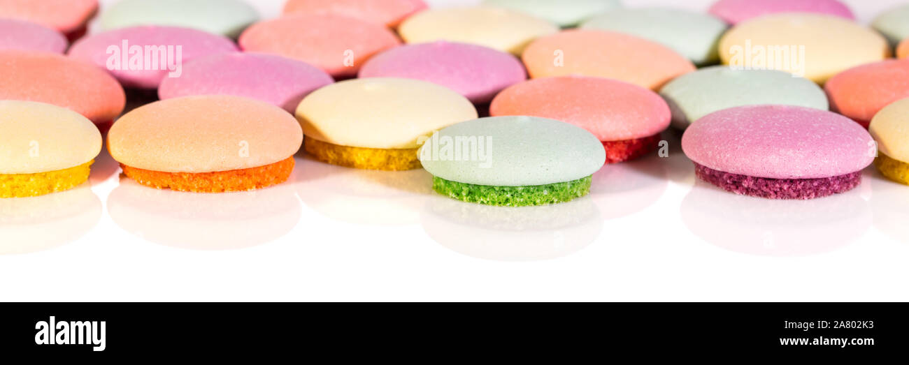 Banner, Biscuits or Macarons various colored on white background, concept confectionery Stock Photo