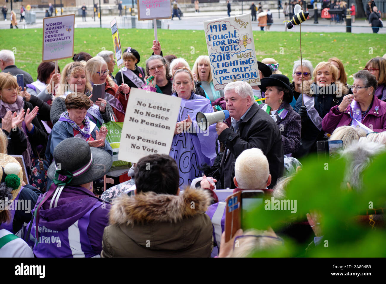 Westminster, London, UK. 5th November 2019.  Hugh Gaffney, Scottish Labour MP for Coatbridge, Chryston and Bellshill addressing crowd at WASPI (Women Against State Pension Injustice) rally in front on Parliament today.  Local women joined by Welsh contingent to ensure that poverty for women born in the 1950s is included in electoral manifesto of the Labour party. . Credit: JF Pelletier / Alamy Live News Stock Photo