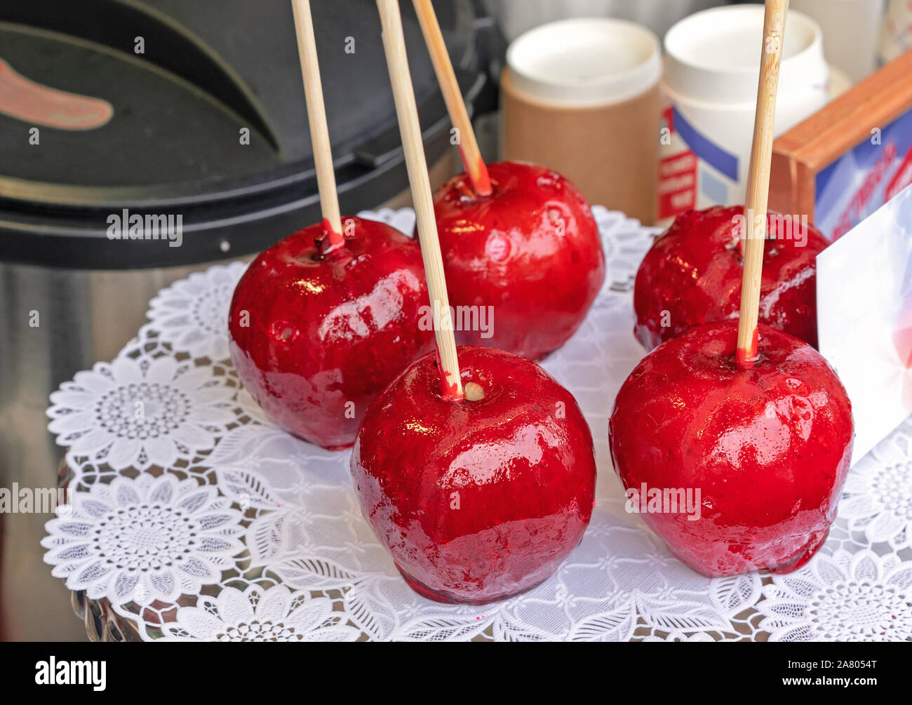 Candy Apple or Taffy Apple - red caramelized apples on a stick. Stock Photo