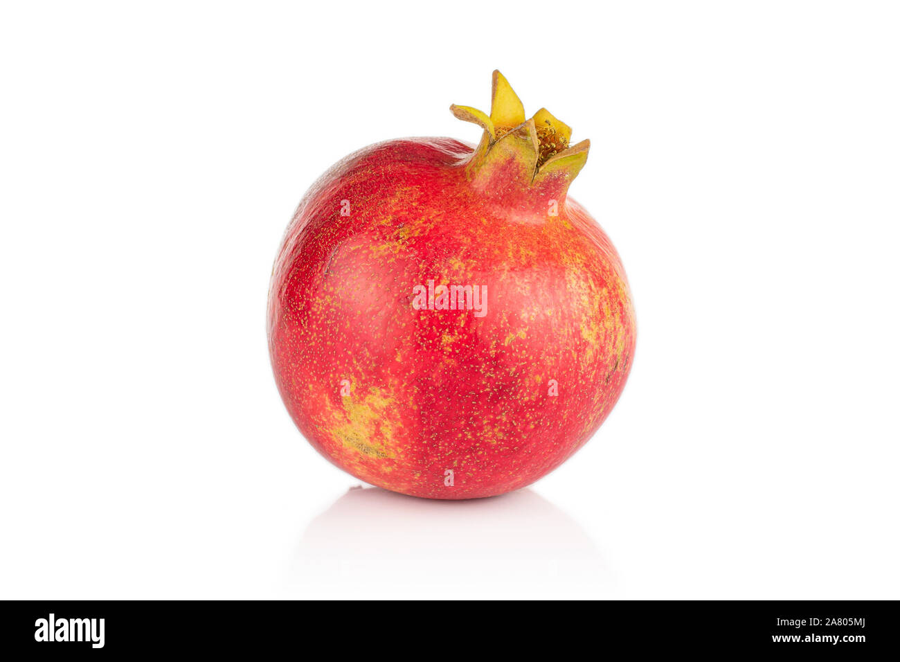 One whole fresh red pomegranate isolated on white background Stock Photo