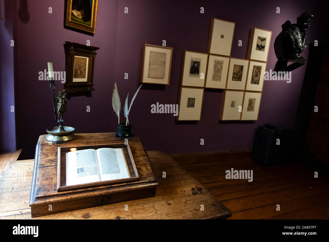 Brussels, Belgium - November 3 2019: Desk with old book in Latin about at the Erasmus house in Anderlecht. Stock Photo