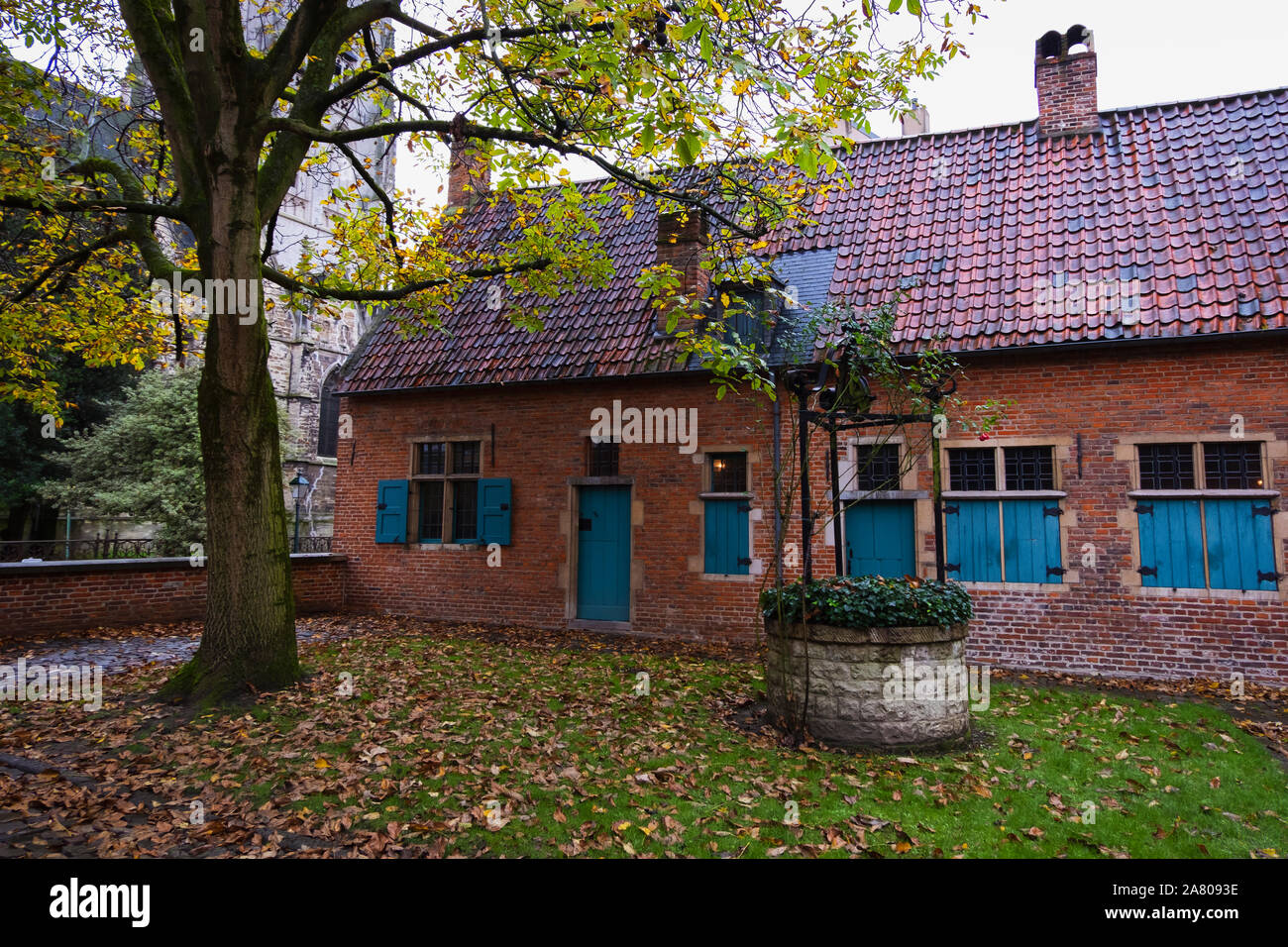 Brussels, Belgium - November 3 2019: Inner court of the medieval Anderlecht Old Beguinage. The site was once home to eight beguines, whose community w Stock Photo