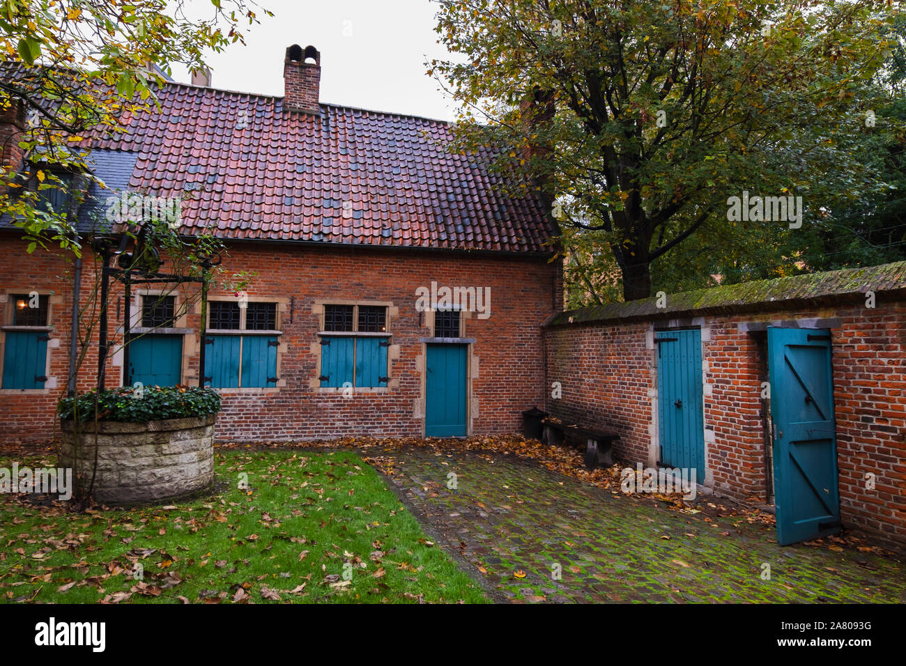 Brussels, Belgium - November 3 2019: Inner court of the medieval Anderlecht Old Beguinage. The site was once home to eight beguines, whose community w Stock Photo