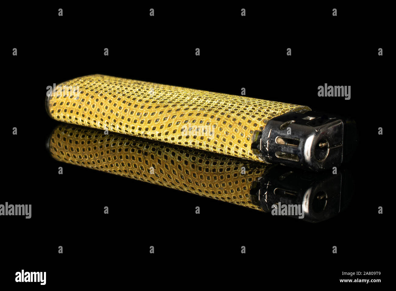 One whole plastic lighter isolated on black glass Stock Photo Alamy