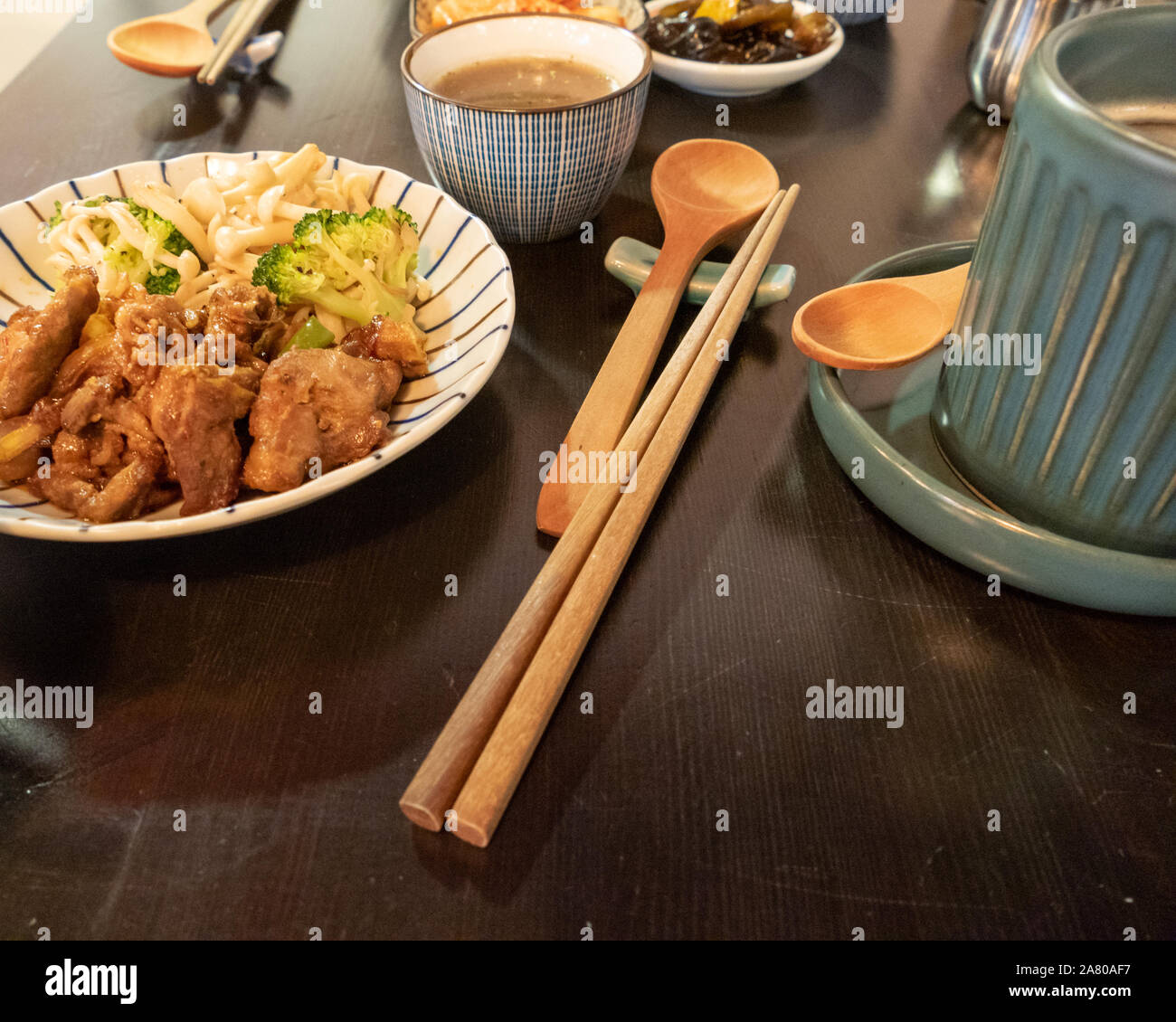 Chinese style pork dish on table with side dishes Stock Photo