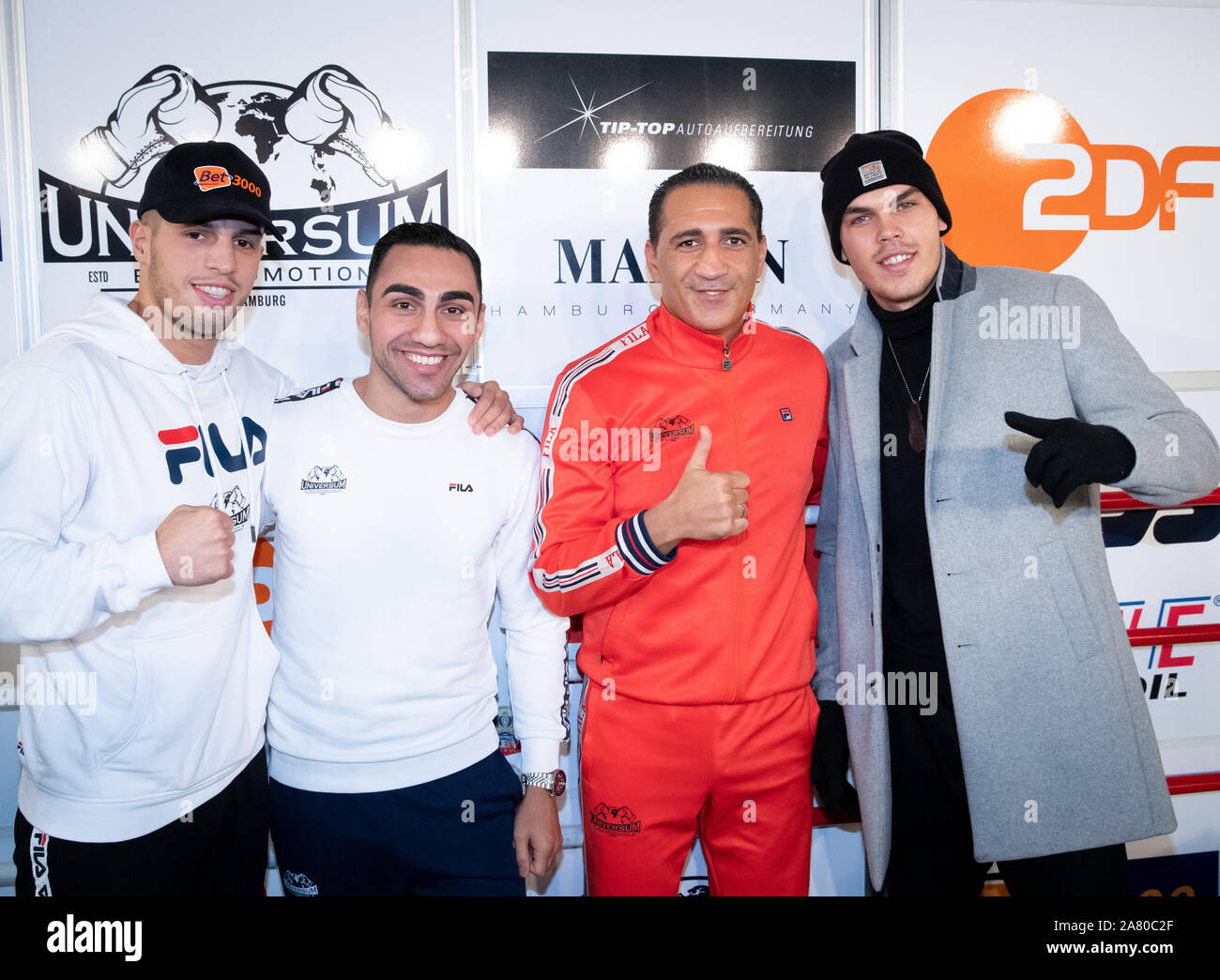 Hamburg, Germany. 05th Nov, 2019. Ismail Özen-Otto (2nd from right), Promoter Universum Box Promotion, and the boxers (l-r) Toni Kraft, Artem Harutyunyan and Leon Bauer are together after a press conference in the Box-Gym Universum. Harutyunyan from Germany and Islam Dumanov from Russia fight on 09.11.2019 for the IBO International title in super light weight. Credit: Christian Charisius/dpa/Alamy Live News Stock Photo