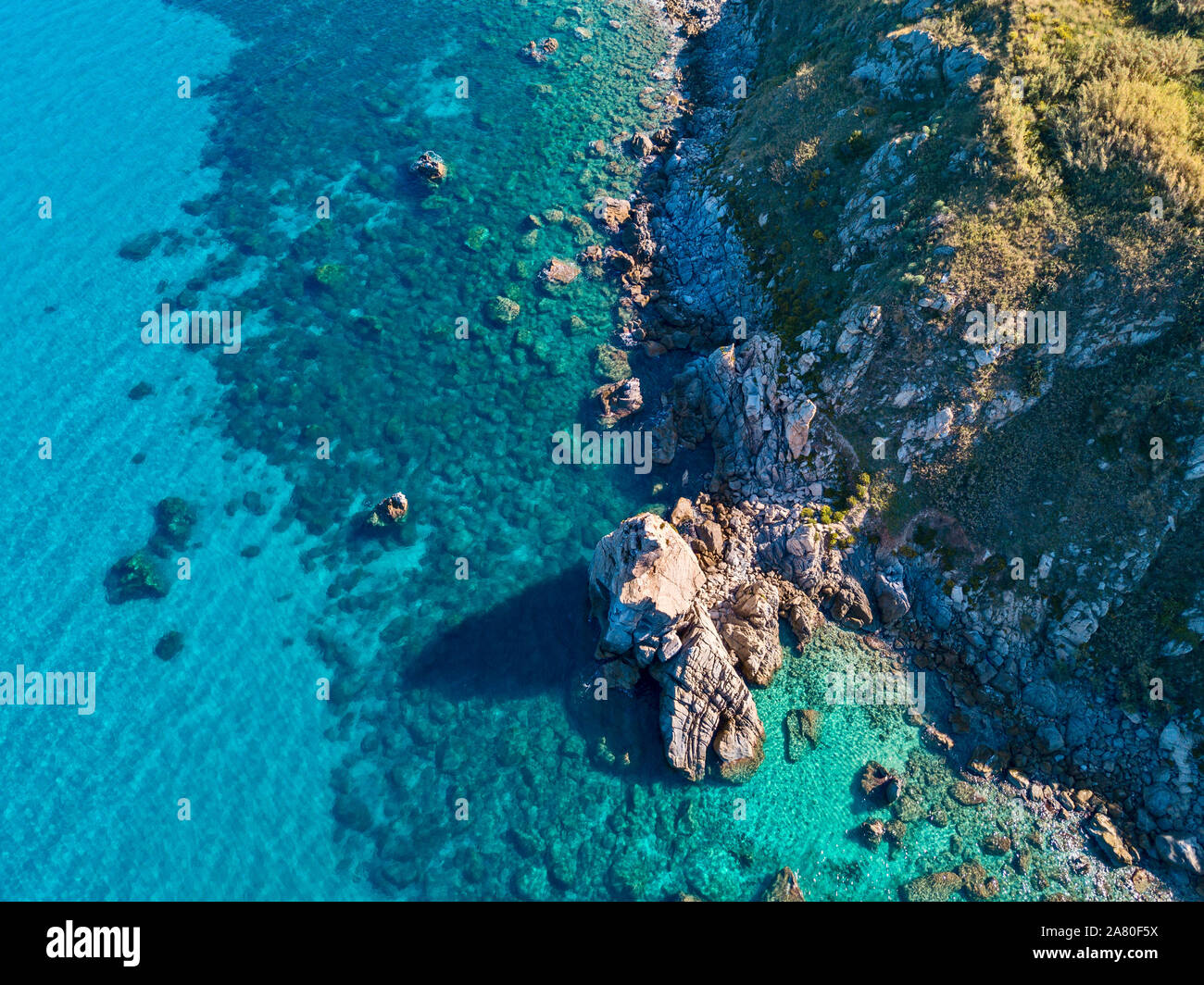 Aerial view of Tropea beach, crystal clear water and rocks that appear ...