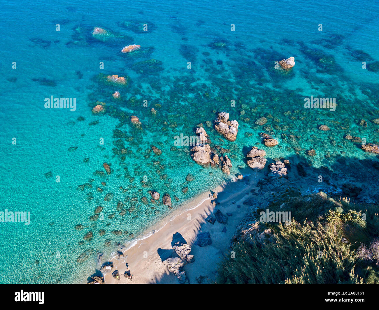 Aerial view of Tropea beach, crystal clear water and rocks on the beach ...