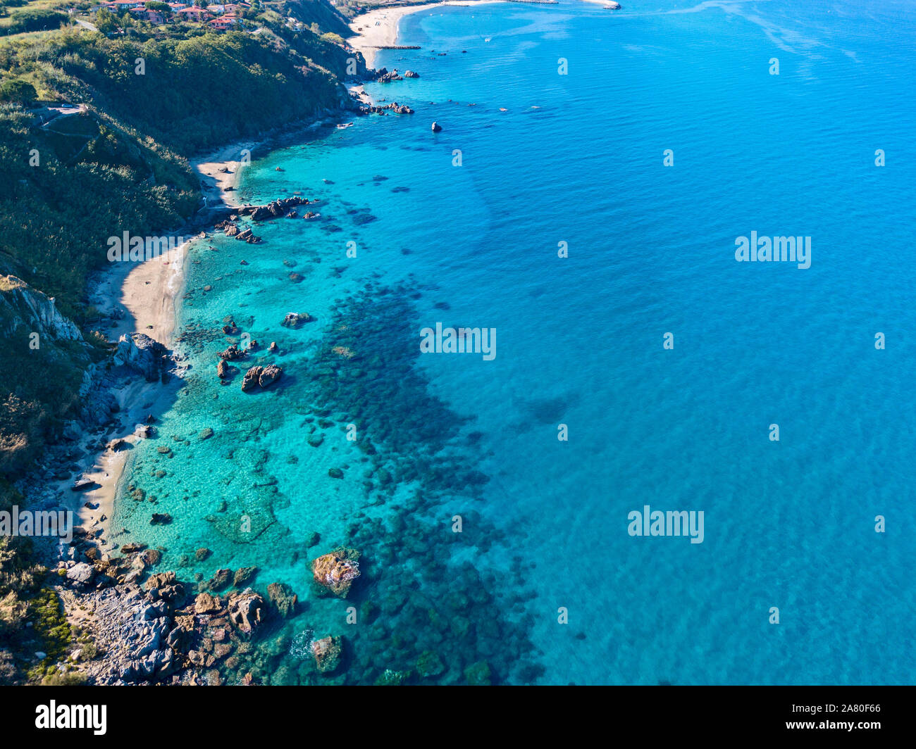 Aerial view of Tropea beach, crystal clear water and rocks on the beach ...