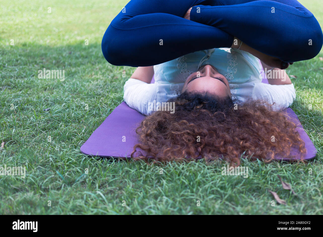 Woman doing yoga in Lodhi Garden in New Delhi India Stock Photo