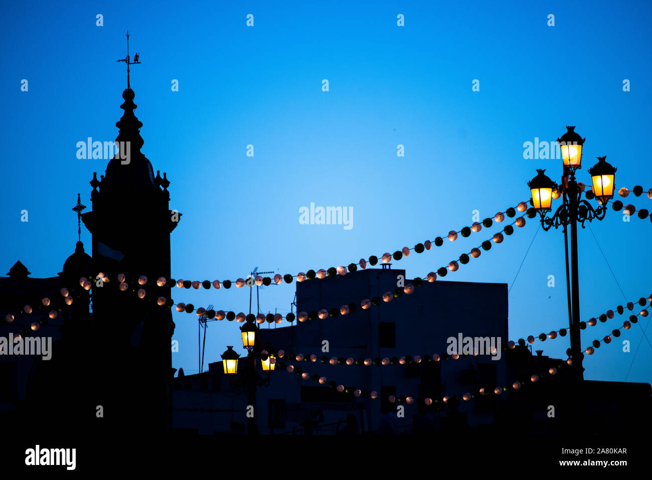 Paper lanterns on the Triana bridge for the Vela de Santa Ana festival, Seville, Spain Stock Photo