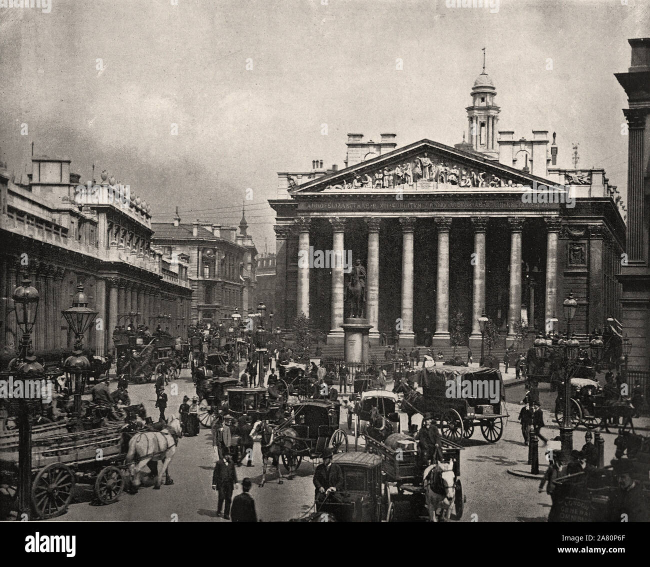 From 'The Descriptive Album of London' by George H Birch 1896 - Extracted text : ' ROYAL EXCHANGE.—Close to the Bank to which it forms a fitting adjunct. The present building was erected by Sir William Tite, and opened by the Queen in 1845, its predecessor having been burnt after an existence of scarcely 200 years, which, in its turn, had re-placed an older structure destroyed in the Great Fire, and originally built by Sir Thomas Gresham and opened by Queen Elizabeth. The Corinthian Portico is undoubtedly very fine and well proportioned, but the sky line is much injured by every conceivable de Stock Photo