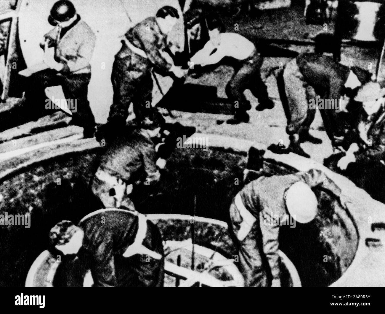 Allied soldiers dismantle a nuclear reactor, World War II Stock Photo