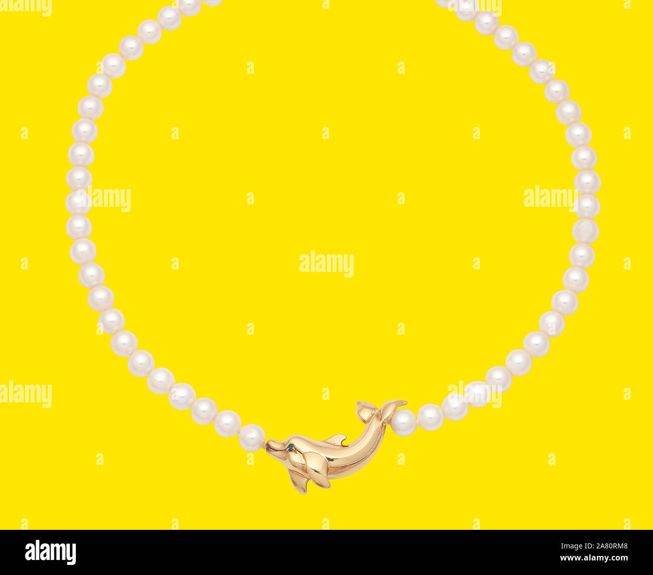 Luxury Pearl necklaces on yellow background Stock Photo