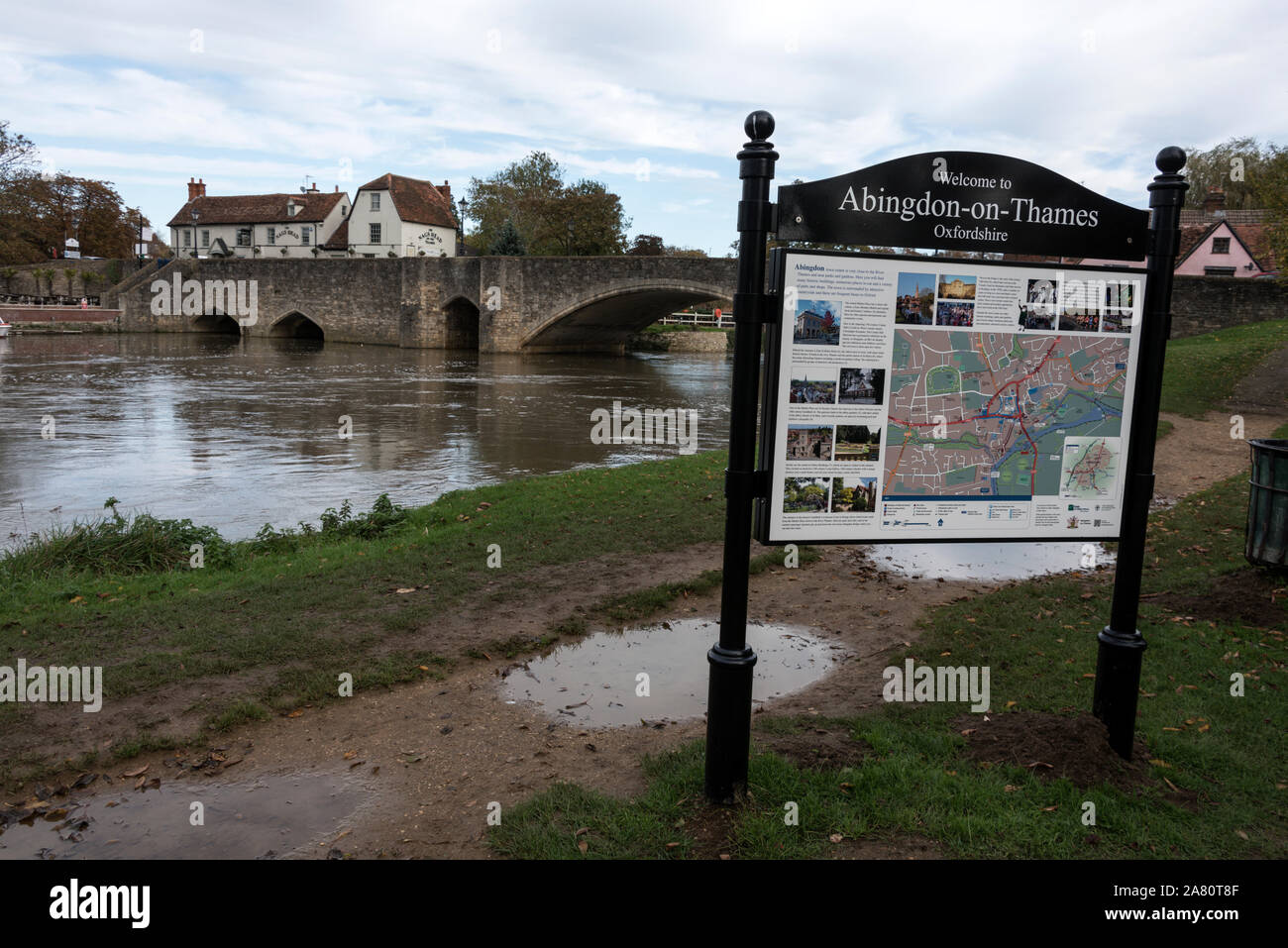 A visitor's display map beside the river Thames and the 550years old road bridge at Abingdon-on-Thames, a historic market town in South Oxfordshire in Stock Photo