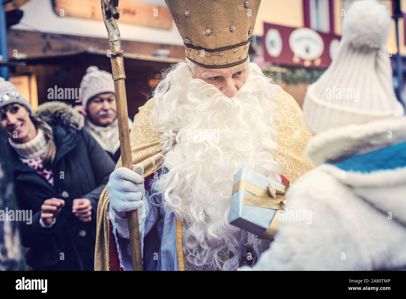 St Nikolaus and an extended family on the Christmas market Stock Photo