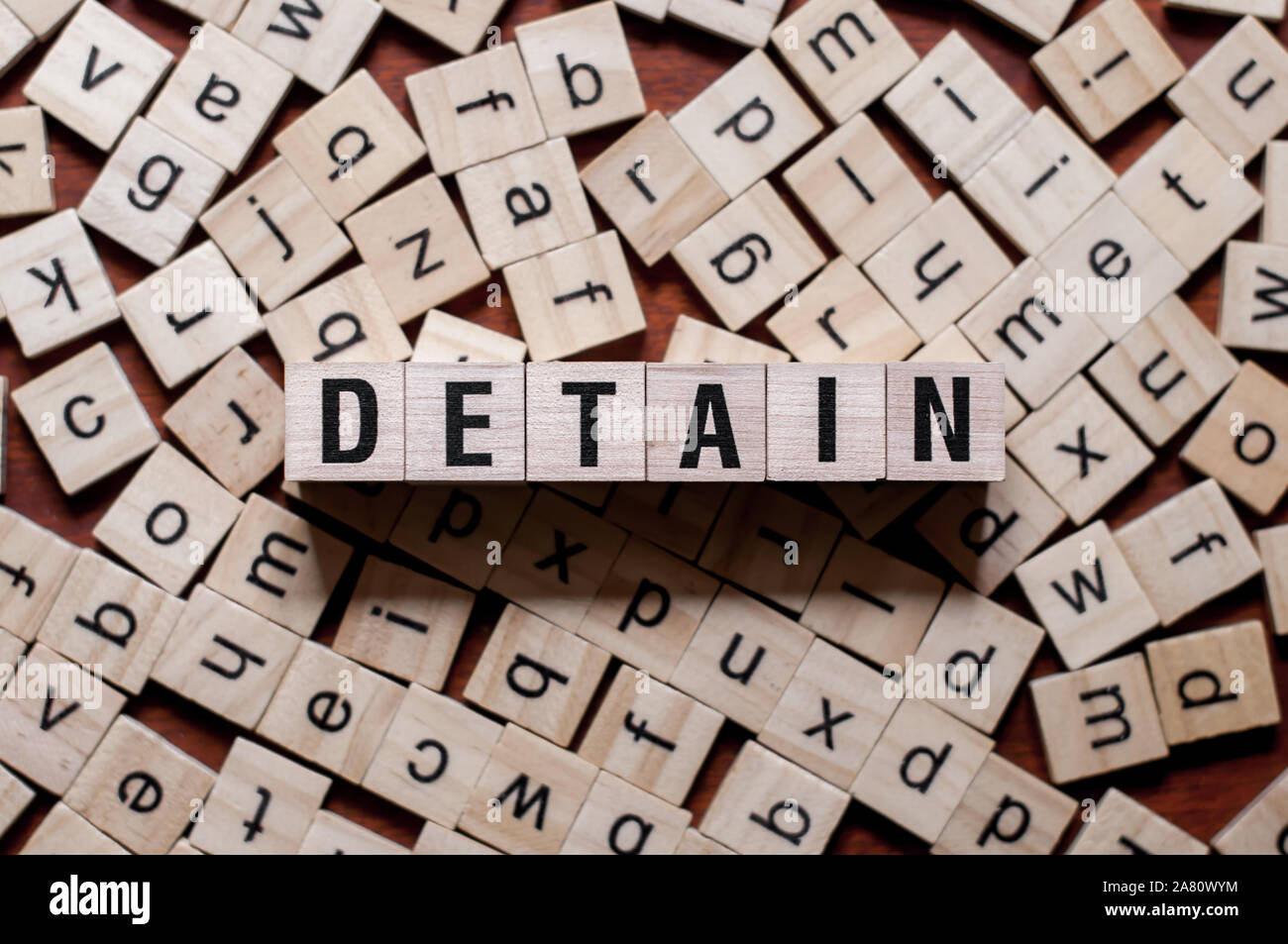 Detain word concept on cubes for articles Stock Photo