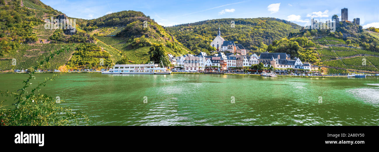 Beilstein on the Moselle river with Metternich Castle, Germany, panorama view with river, ship and vineyards Stock Photo