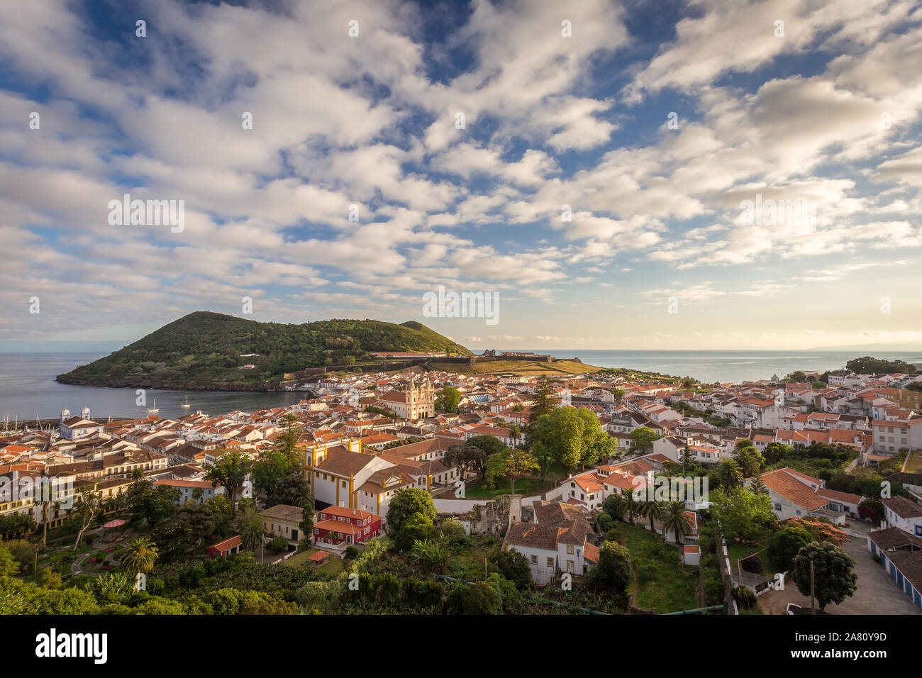 Angra do Heroísmo and Monte Brasil, in Terceira island, Azores, Portugal. Sunny afternoon with beautiful clouds. Stock Photo