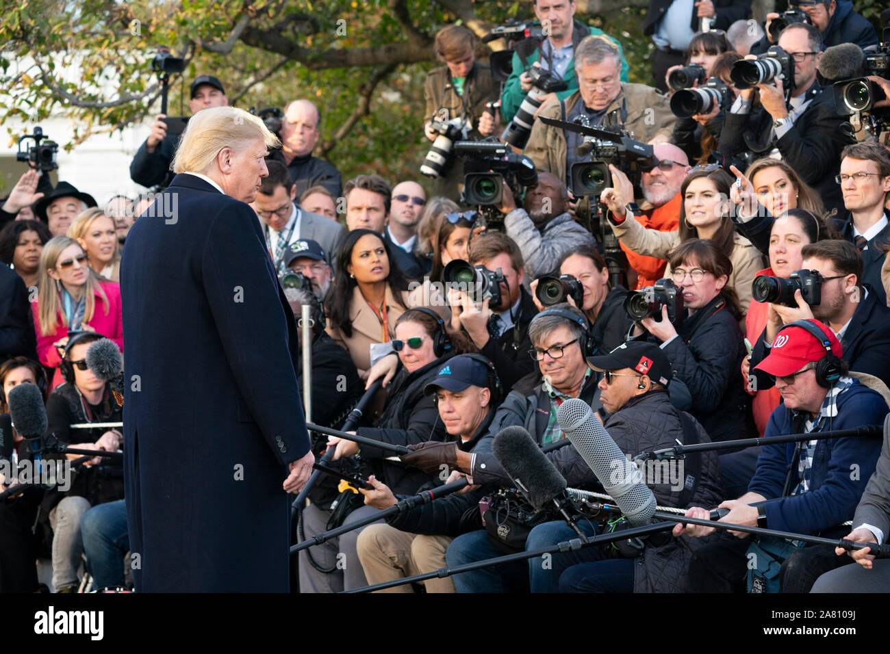 Washington, United States of America. 04 November, 2019. U.S. President Donald Trump stops to speak with the media prior to boarding Marine One to begin his trip to Kentucky on the South Lawn of the White House November 4, 2019 in Washington, DC.  Credit: Joyce Boghosian/White House Photo/Alamy Live News Stock Photo