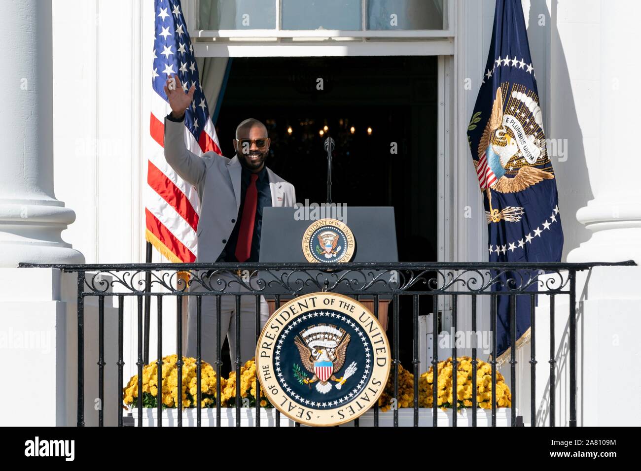 Washington, United States of America. 04 November, 2019. Washington Nationals infielder Howie Kendrick waves from the South Portico balcony of the White House November 4, 2019 in Washington, DC. The 2019 Baseball World Series Champions attended an event in their honor by U.S. President Donald Trump to celebrate their victory.  Credit: Andrea Hanks/White House Photo/Alamy Live News Stock Photo
