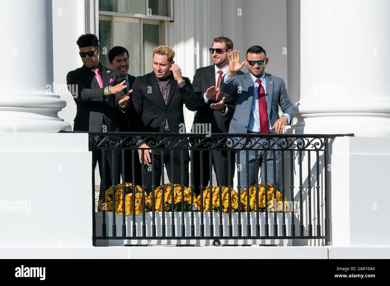 Washington, United States of America. 04 November, 2019. Washington Nationals team members wave to gathered fans from the South Portico balcony of the White House November 4, 2019 in Washington, DC. The 2019 Baseball World Series Champions attended an event in their honor by U.S. President Donald Trump to celebrate their victory.  Credit: Andrea Hanks/White House Photo/Alamy Live News Stock Photo