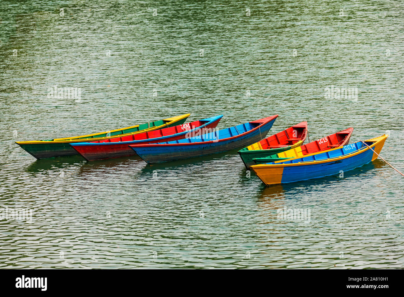 Boats with different colors,Main tourist attraction in Phewa Lake Pokhara Nepal Stock Photo