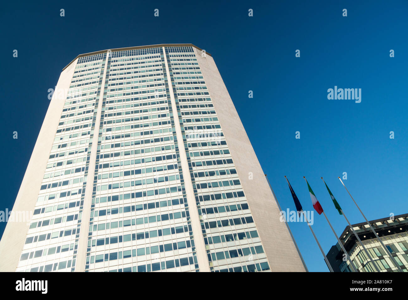 Milan, Italy: skyscraper Pirelli Tower, commonly known as Pirellone, against blue sky background. Stock Photo