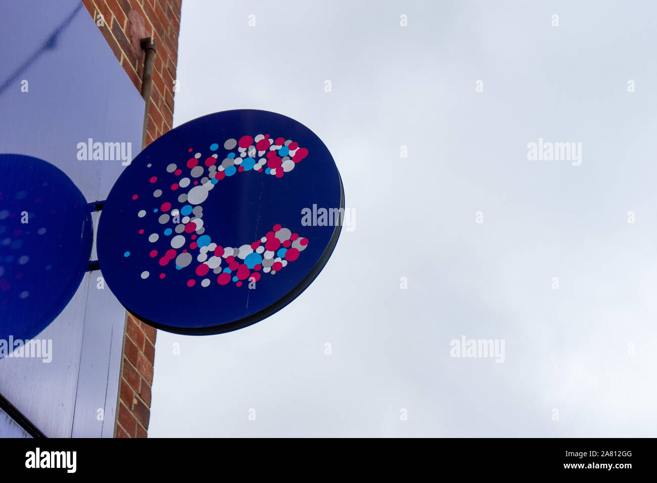 The sign to a cancer research UK charity shop Stock Photo