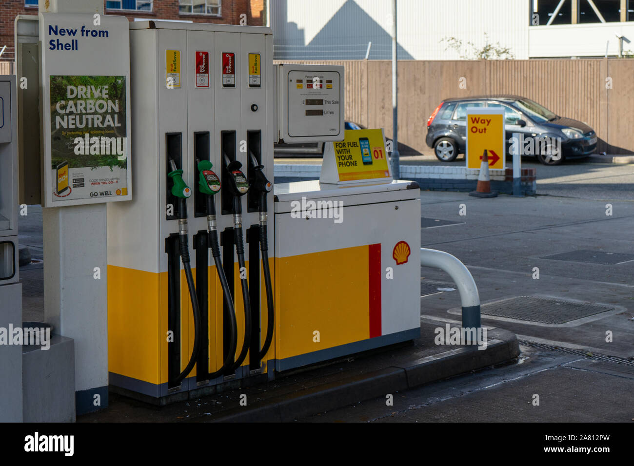 a self service fuel pump at a shell garage forecourt Stock Photo