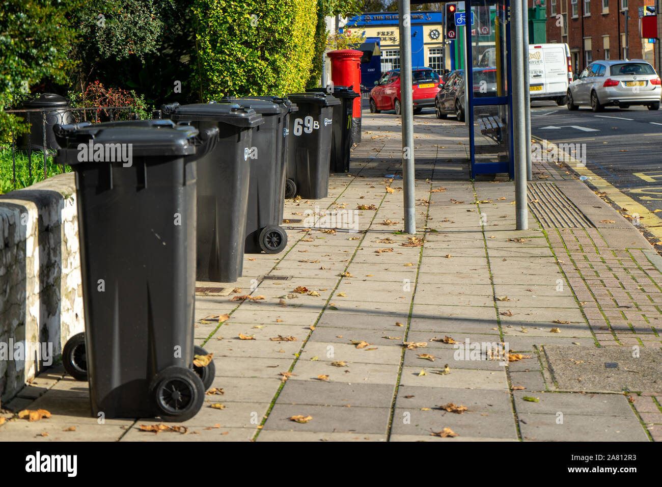 Black wheelie bins hi-res stock photography and images - Alamy