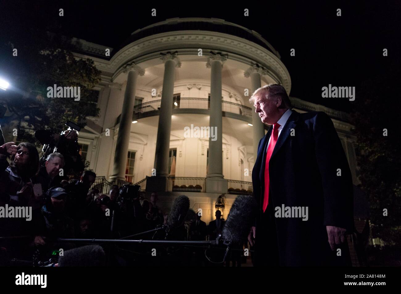 U.S. President Donald Trump stops to speak with the media, on his way to New York City from the South Lawn of the White House November 2, 2019 in Washington, DC. Stock Photo