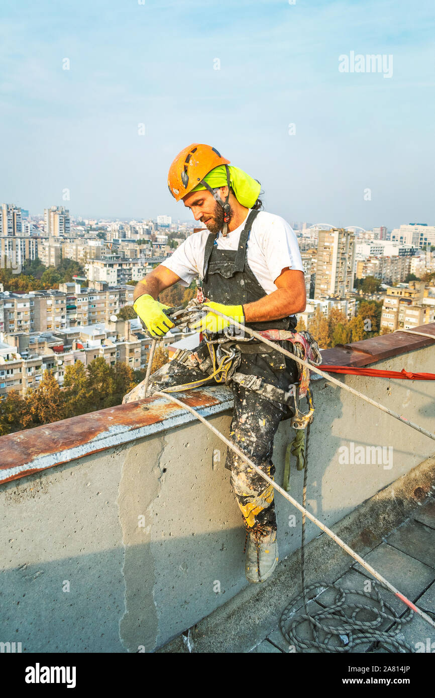 Industrial rope access worker wearing professional safety gears
