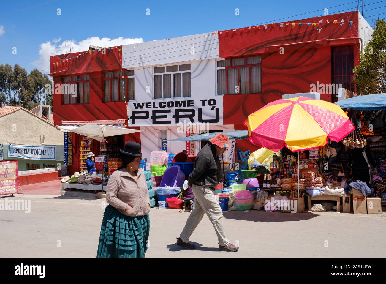 People walking in front the Peru Customs building on the Peru-Bolivia border near Puno Stock Photo