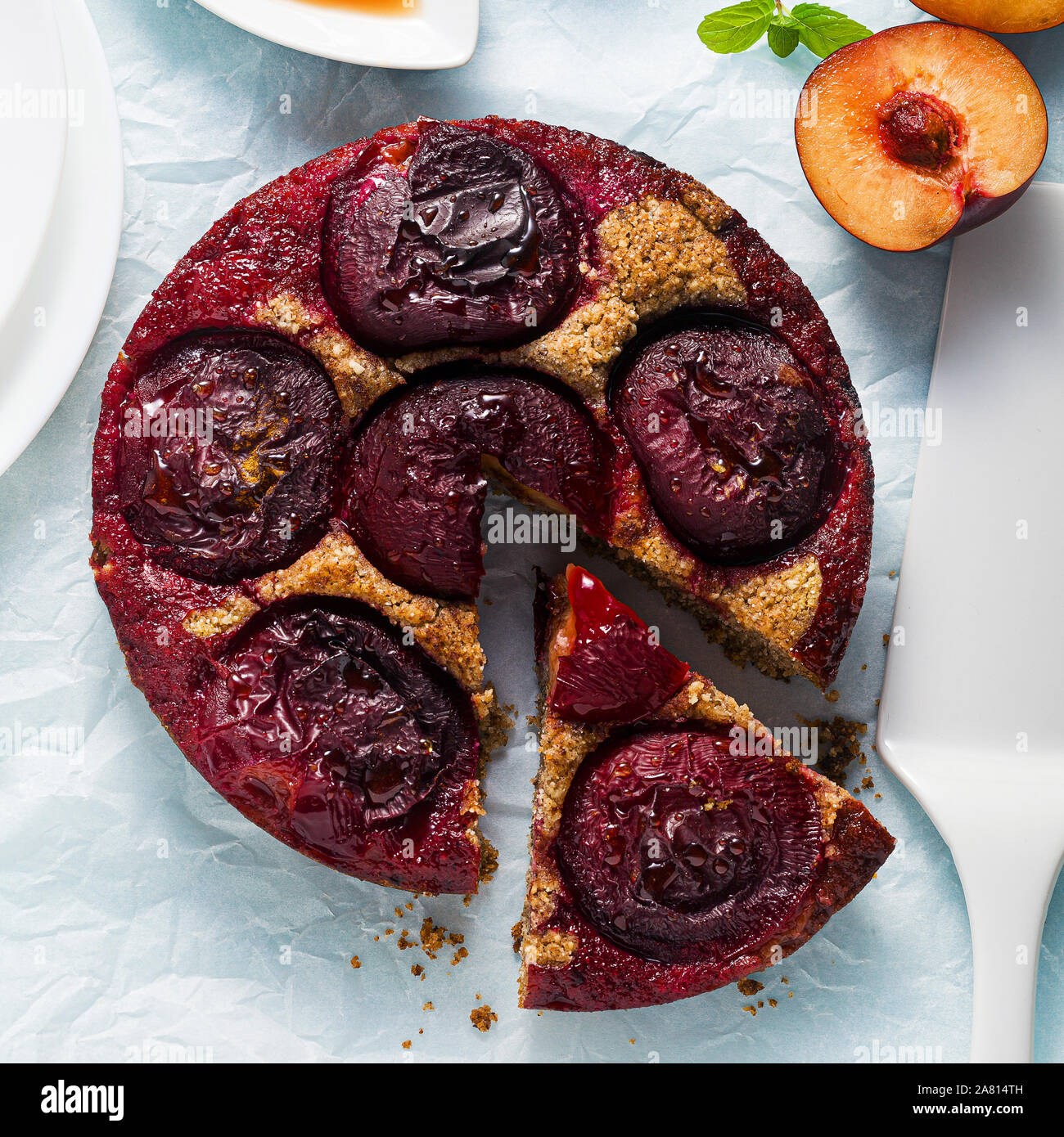 vegan cake with fresh plums and maple syrup. gluten free and refined