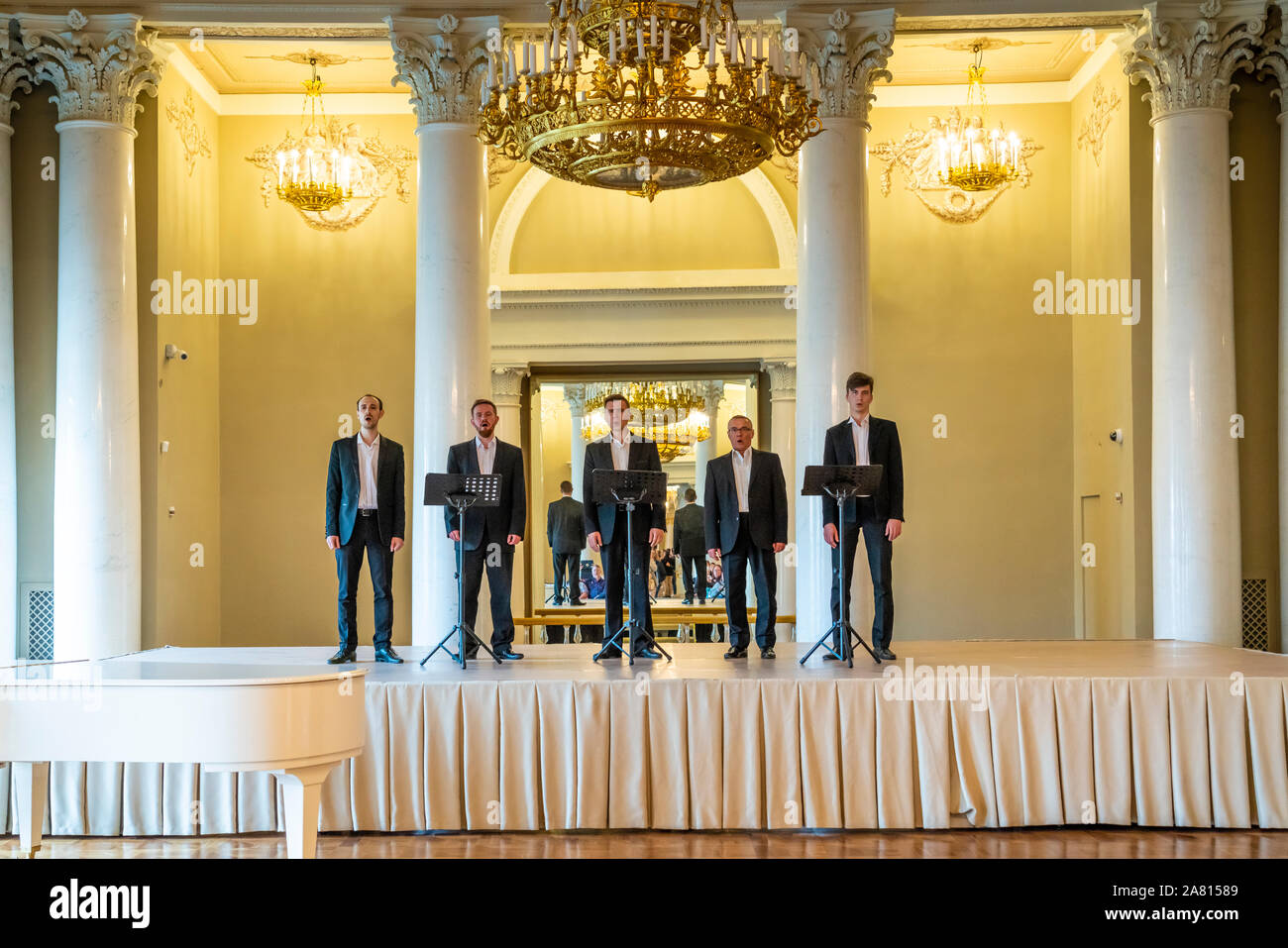 Men singing at  the Yusopov Palace in St. Petersburg, Russia. Stock Photo