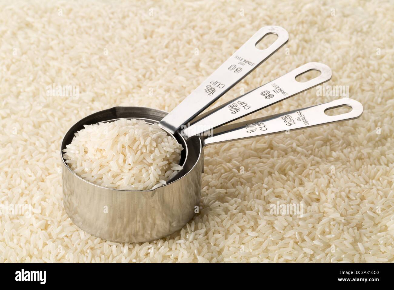 White Long Grain Rice In An American Metal Cup Measure Stock Photo -  Download Image Now - iStock