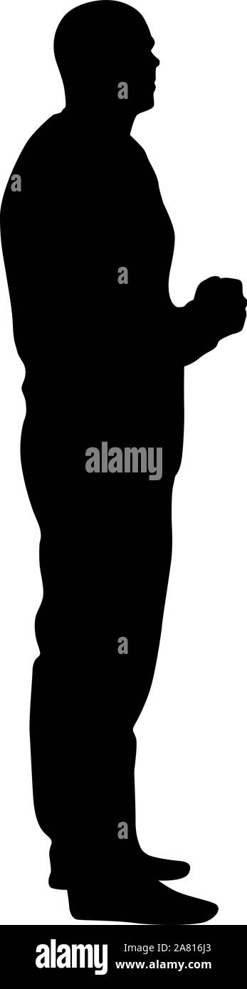 A man stands with his hands in front, silhouette on a white background ...