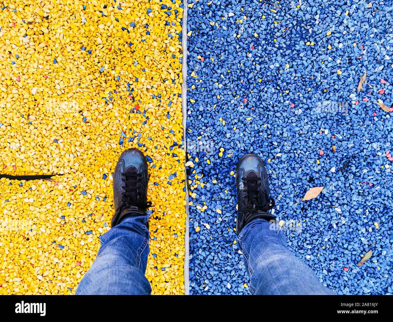 Concept of a woman in confortable shoes standing in the pebbles Stock Photo