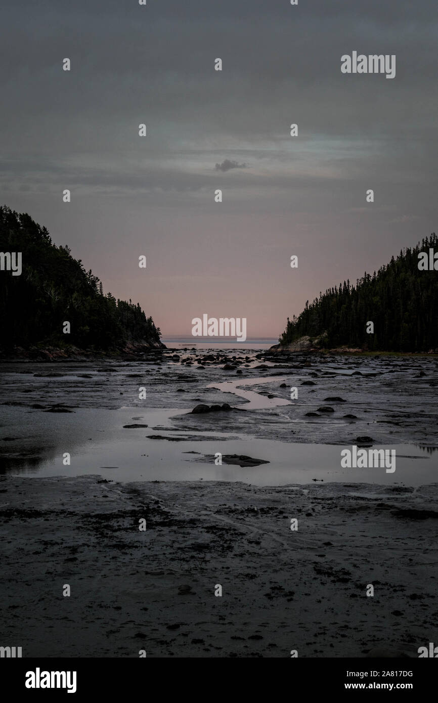 bay with water. pink background. Baie des rochers. Canada Quebec Stock