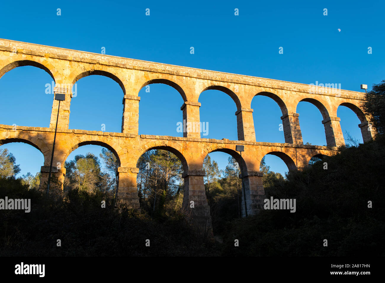 Tarragona Spain. Roman Ponte.Roman aqueduct with arches. Blue sky with sunset. Stock Photo