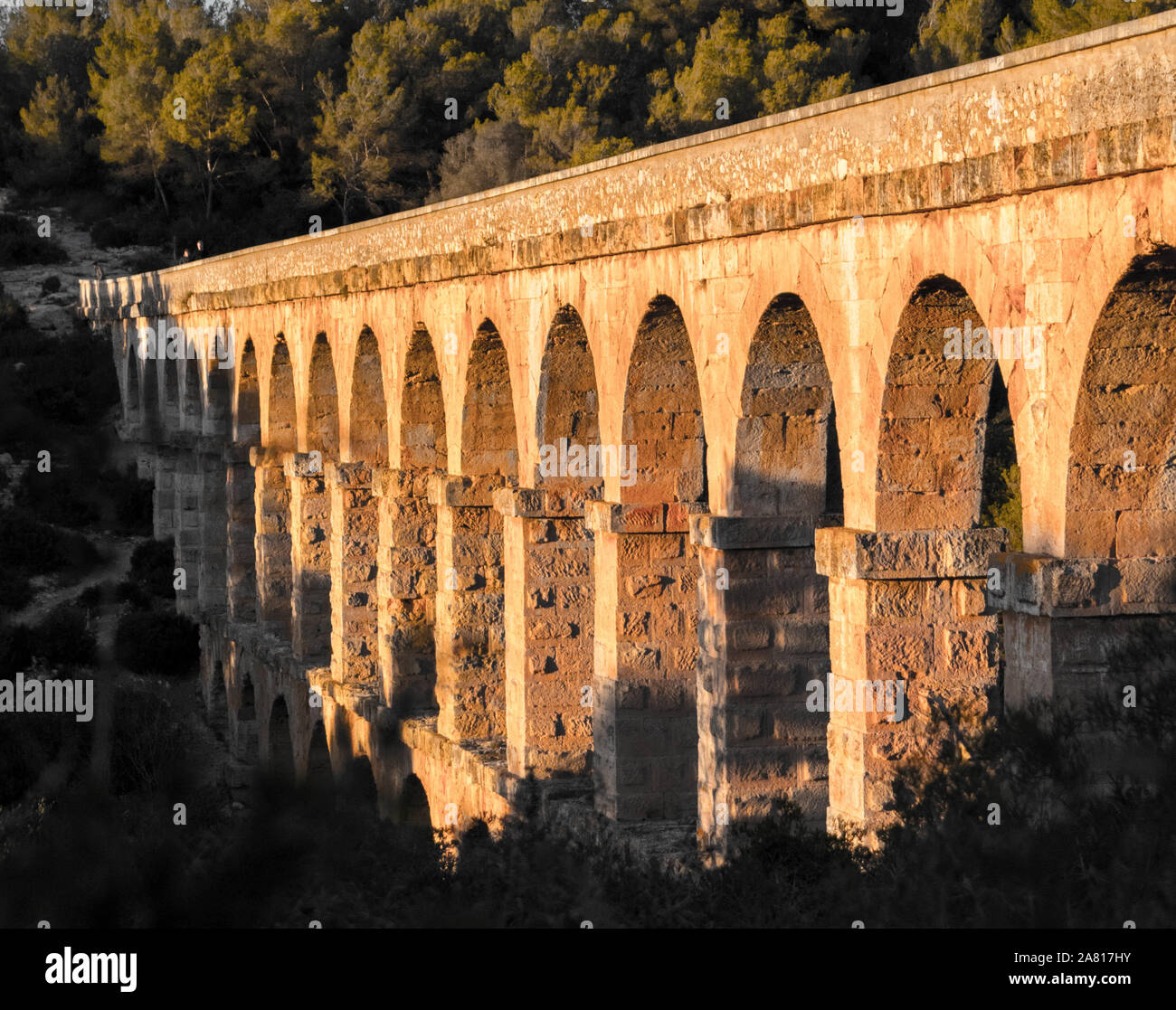 Tarragona Spain. Roman Ponte.Roman aqueduct with arches. Blue sky with sunset. Stock Photo