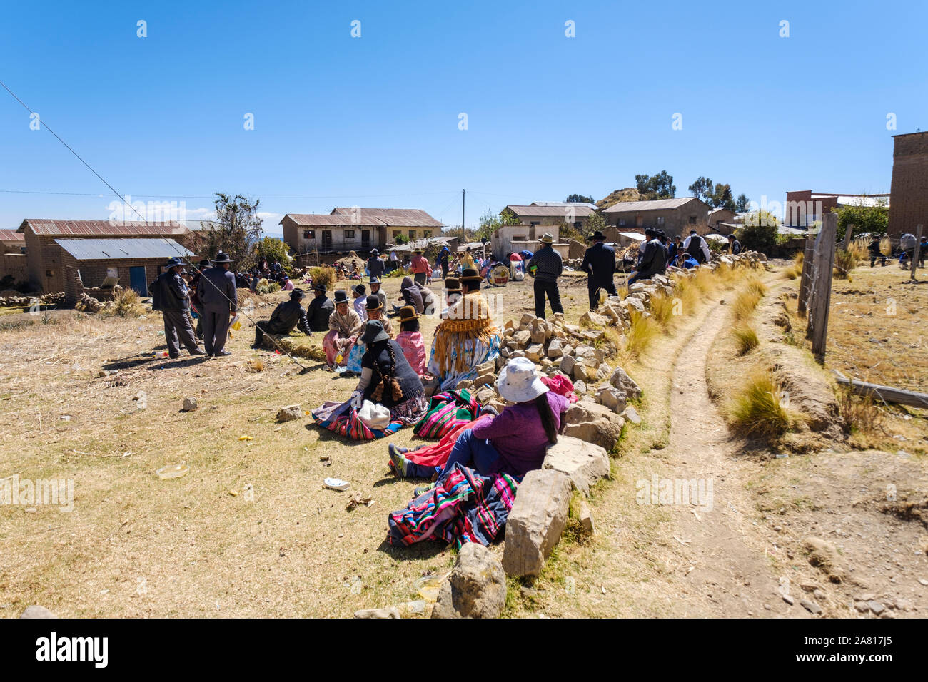 People well dressed celebrating their local festivity at Yampupata