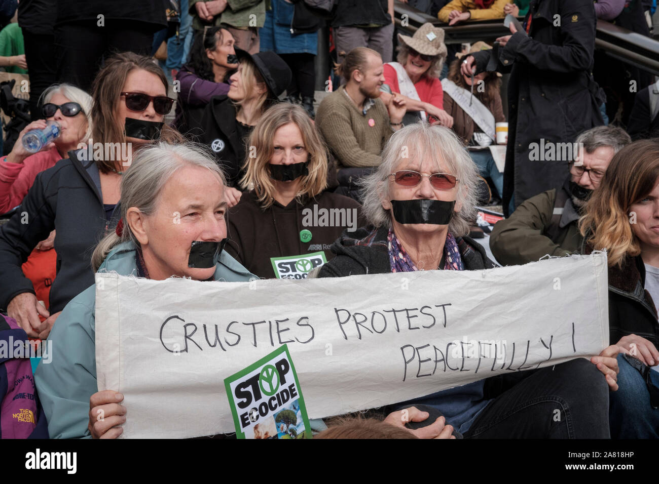 London,UK, 16Th October 2019. On  the second week of Extinction Rebelion October Action, many put tape over their mouths . Stock Photo