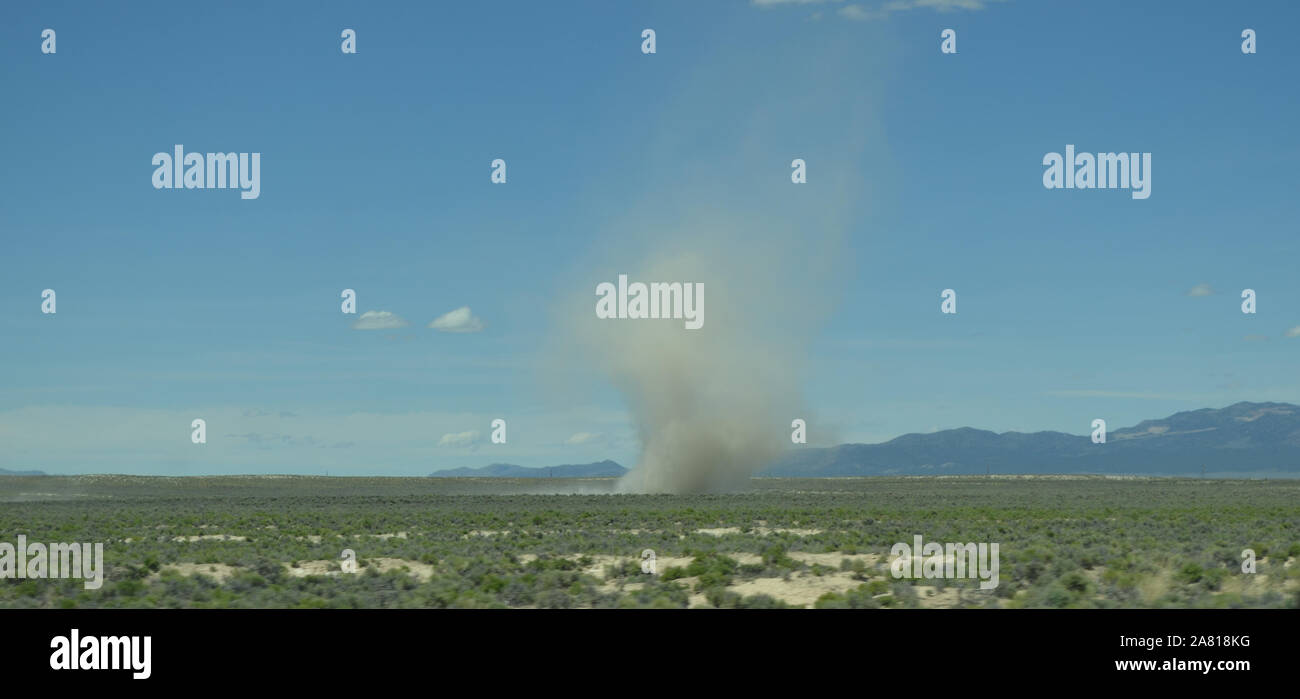 Late Spring in Nevada: Dust Devil Kicks Up on the Barren Plain Stock Photo