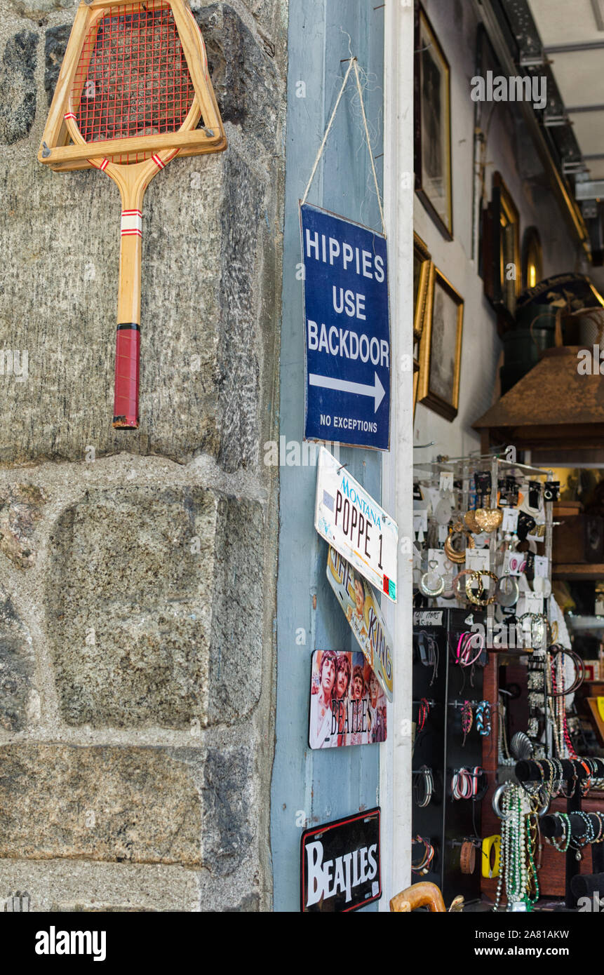 Vintage tennis racket and whimsical signs in an antique store doorway on Main Street, Cold Spring, Putnam County, New York, USA. Stock Photo